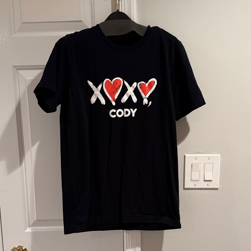 Black Cody from Peloton T-Shirt with Red and White Accents. Size M.